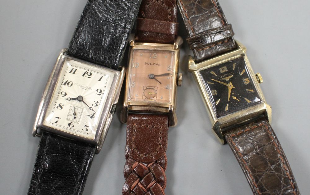 Three assorted gentlemans wrist watches, gold filled Longines, similar Bulova and silver cased, retailed by Thos. Russell & Son.